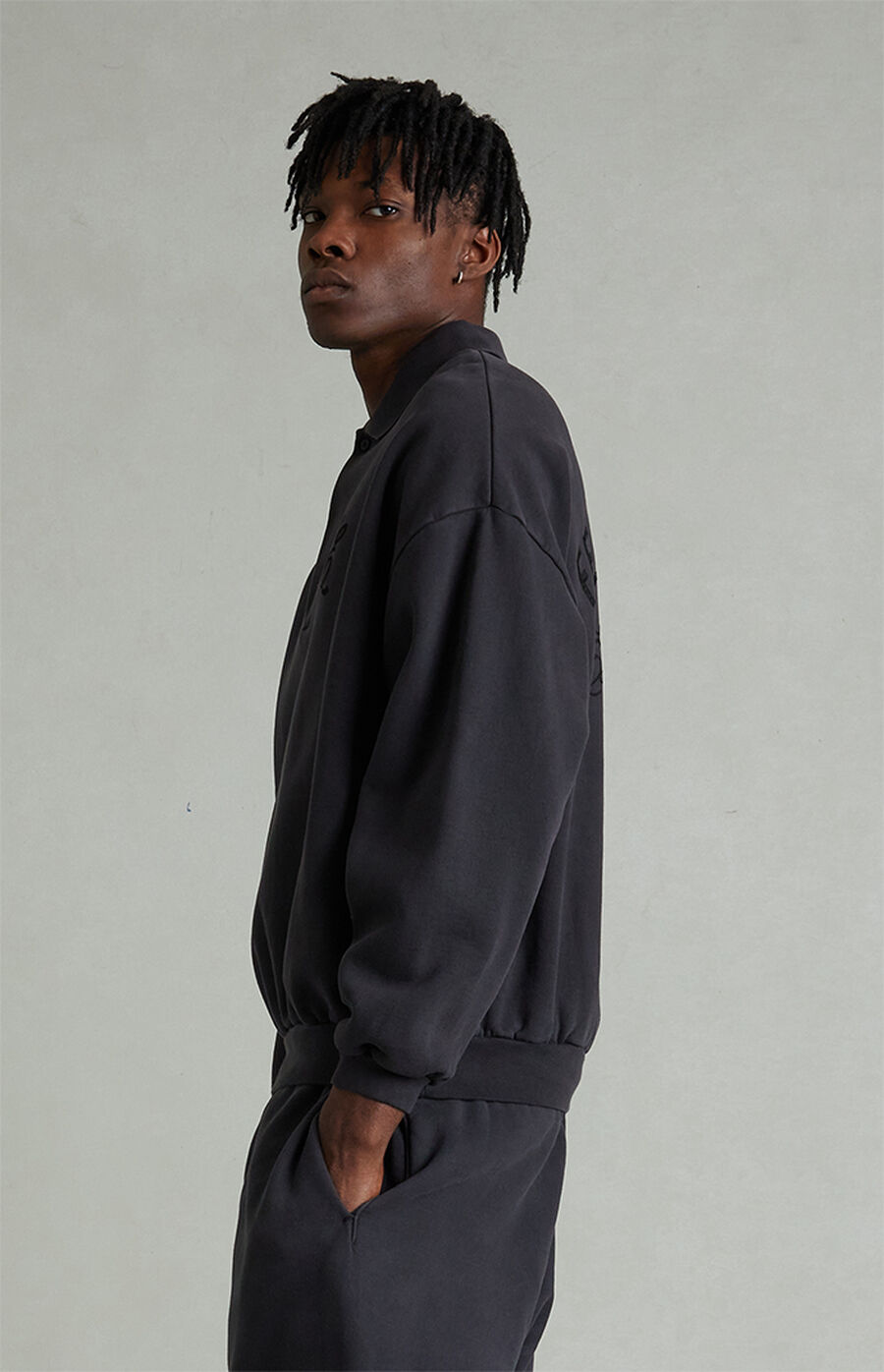 Fear of God ESSENTIALS Vintage Black Classic Polo Sweatshirt | Pacsun
