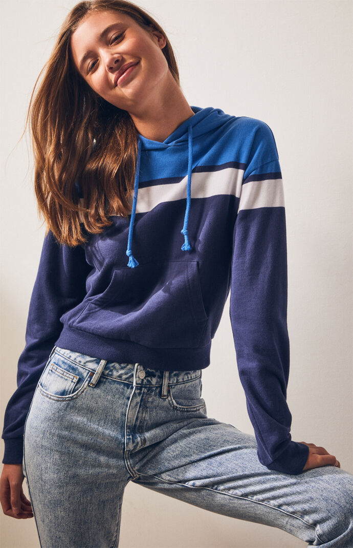 Layer up for fall in the Cropped Pullover Sweatshirt by our very own LA Hearts. This cozy pullover features a drawcord hood, kangaroo pocket, front embroidery detail, long sleeves, a cropped fit, and ribbed cuffs and band. Pullover sweatshirt Drawcord hood Embroidered front detail Kangaroo pocket Long sleeves Ribbed cuffs and band Cropped length Model is wearing a small 60% cotton, 40% polyester Machine washable