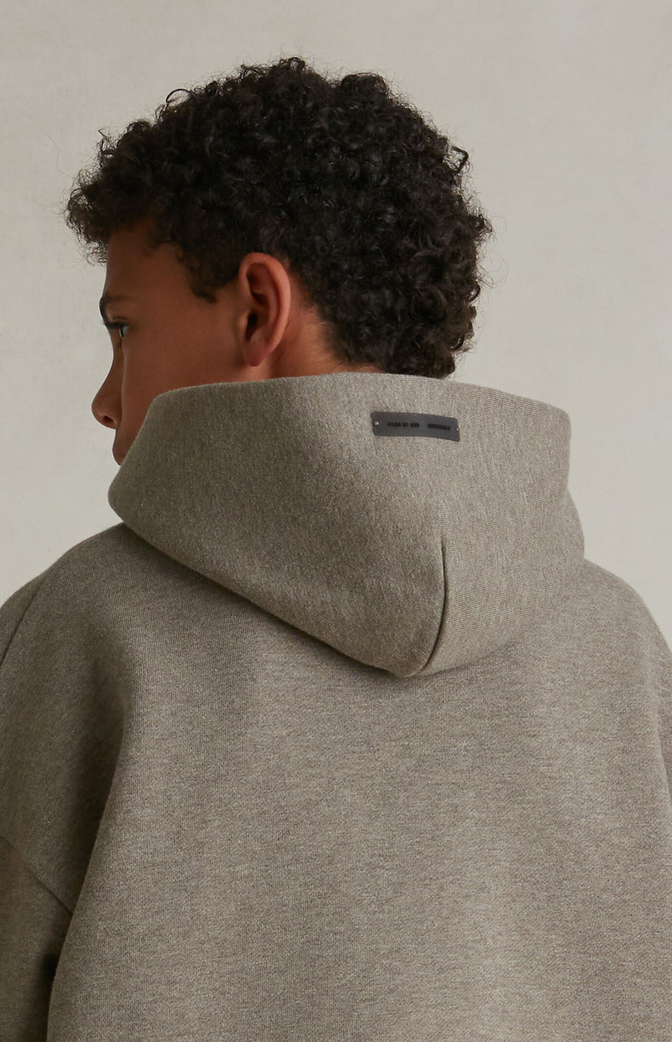Fear of God ESSENTIALS Kids Homestead Heather Fleece Hoodie | Pacsun