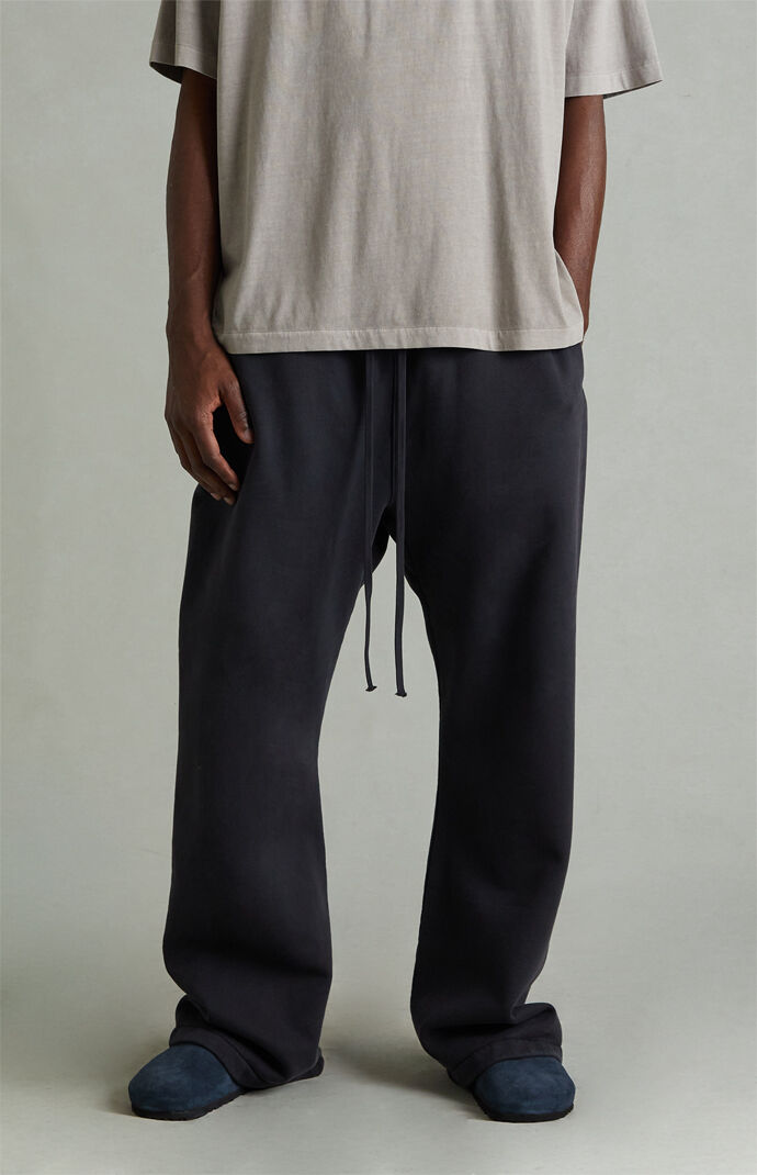 Fear of God ESSENTIALS Vintage Black Fleece Flare Sweatpants | Pacsun