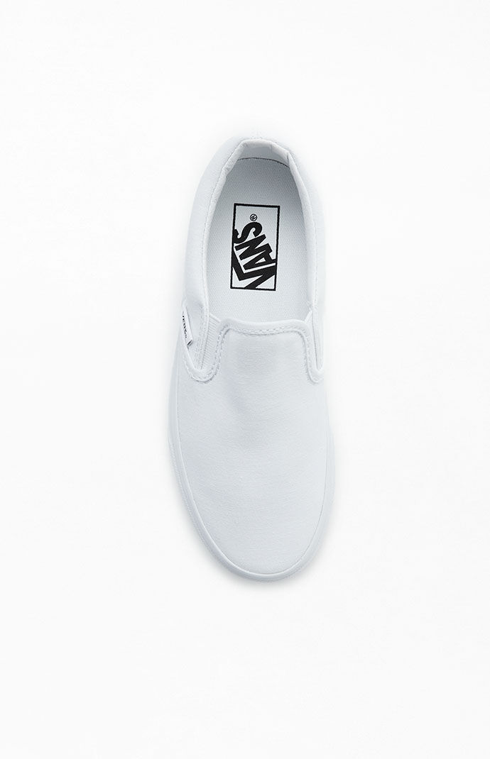 solid white vans slip ons