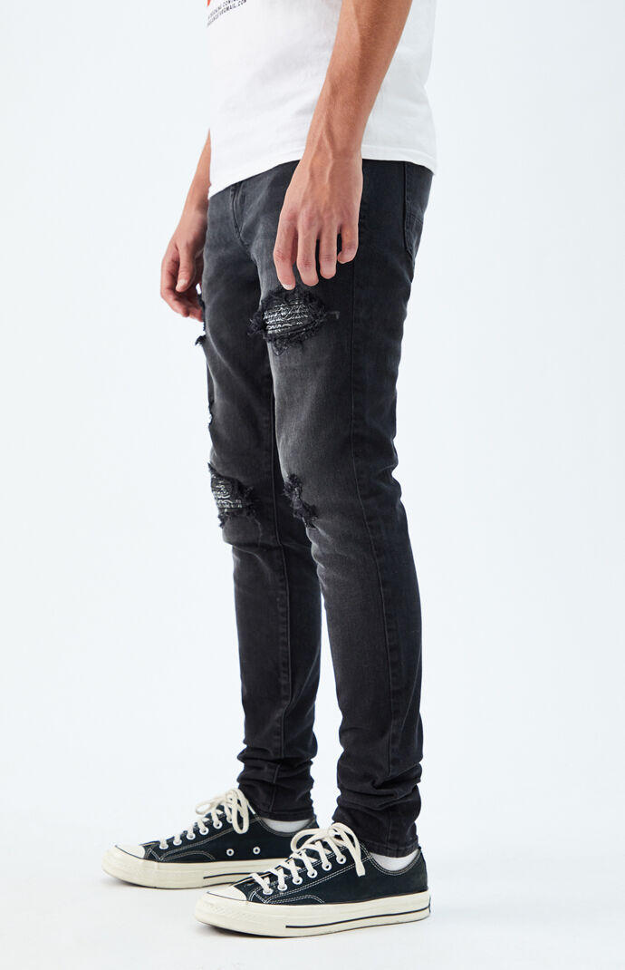Black ripped stacked skinny jeans hotsell