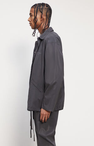 Fear of god essentials coach jacket black reflective clearance