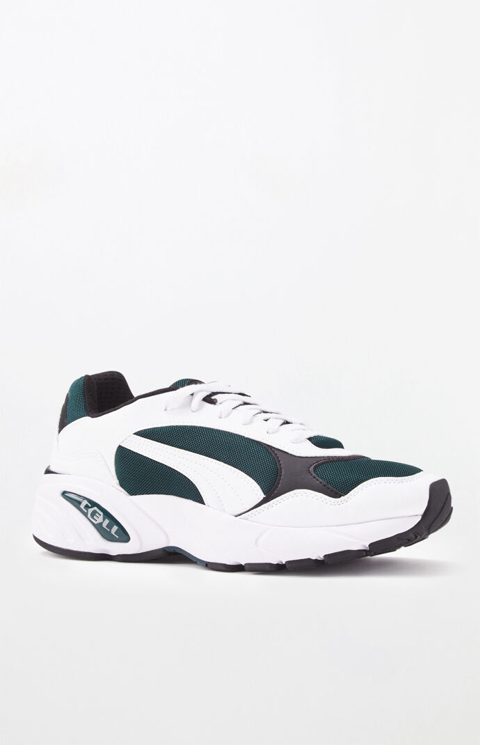 white and green puma shoes