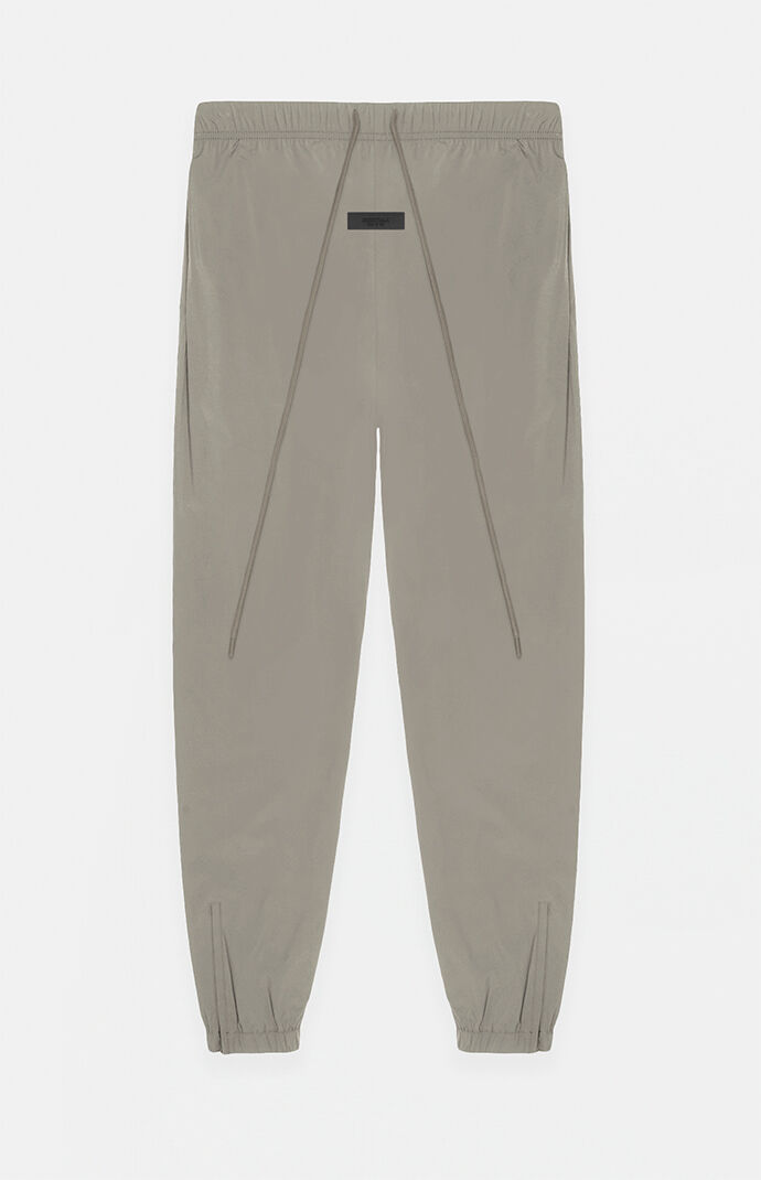 Fear of God Essentials Dust Nylon Track Pants | PacSun