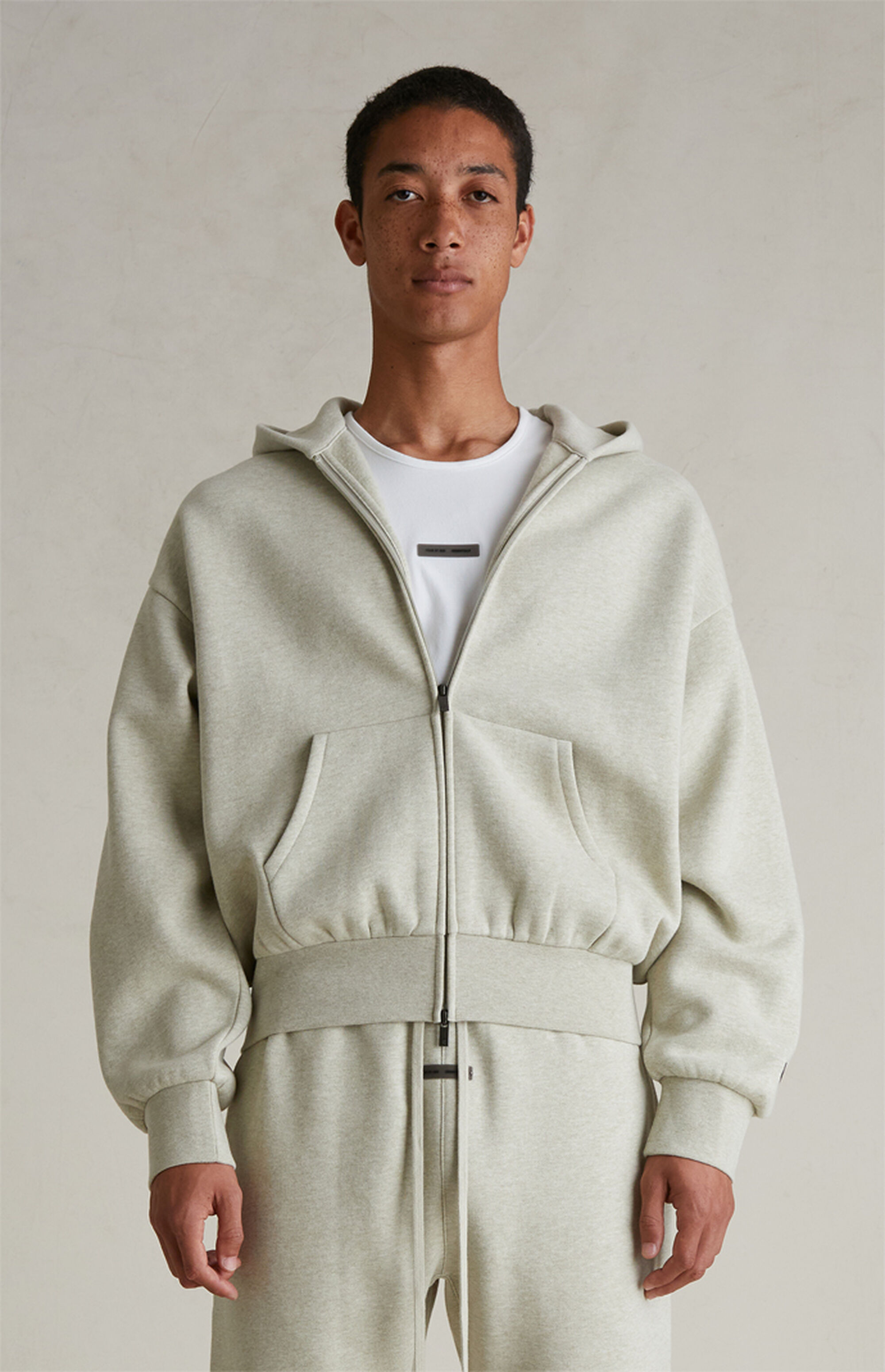 Fear of God ESSENTIALS Heather Stone Classic Fleece Zip Up Hoodie | Pacsun