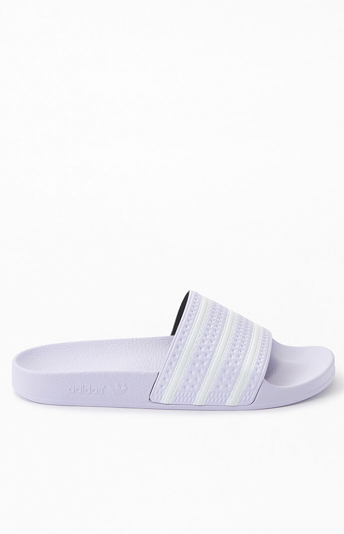 purple adidas flip flops