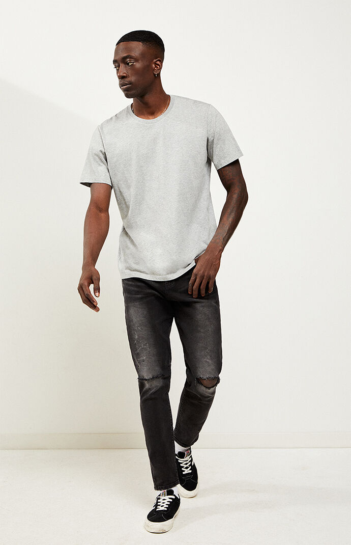 black ripped tapered jeans