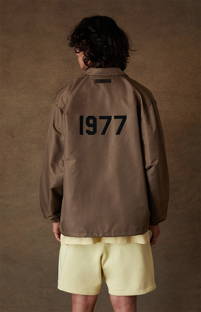 Fear of God Essentials Wood Coach Jacket | PacSun