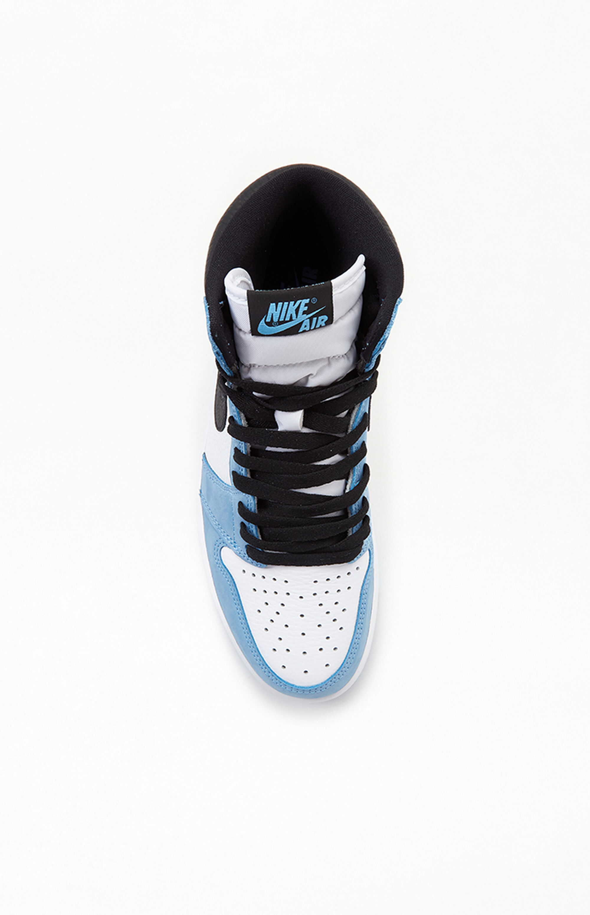 university blue jordan 1 in hand