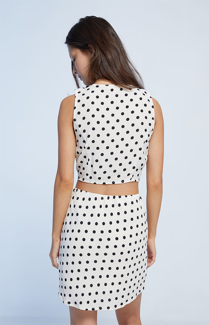 White mini skirt shop with black polka dots