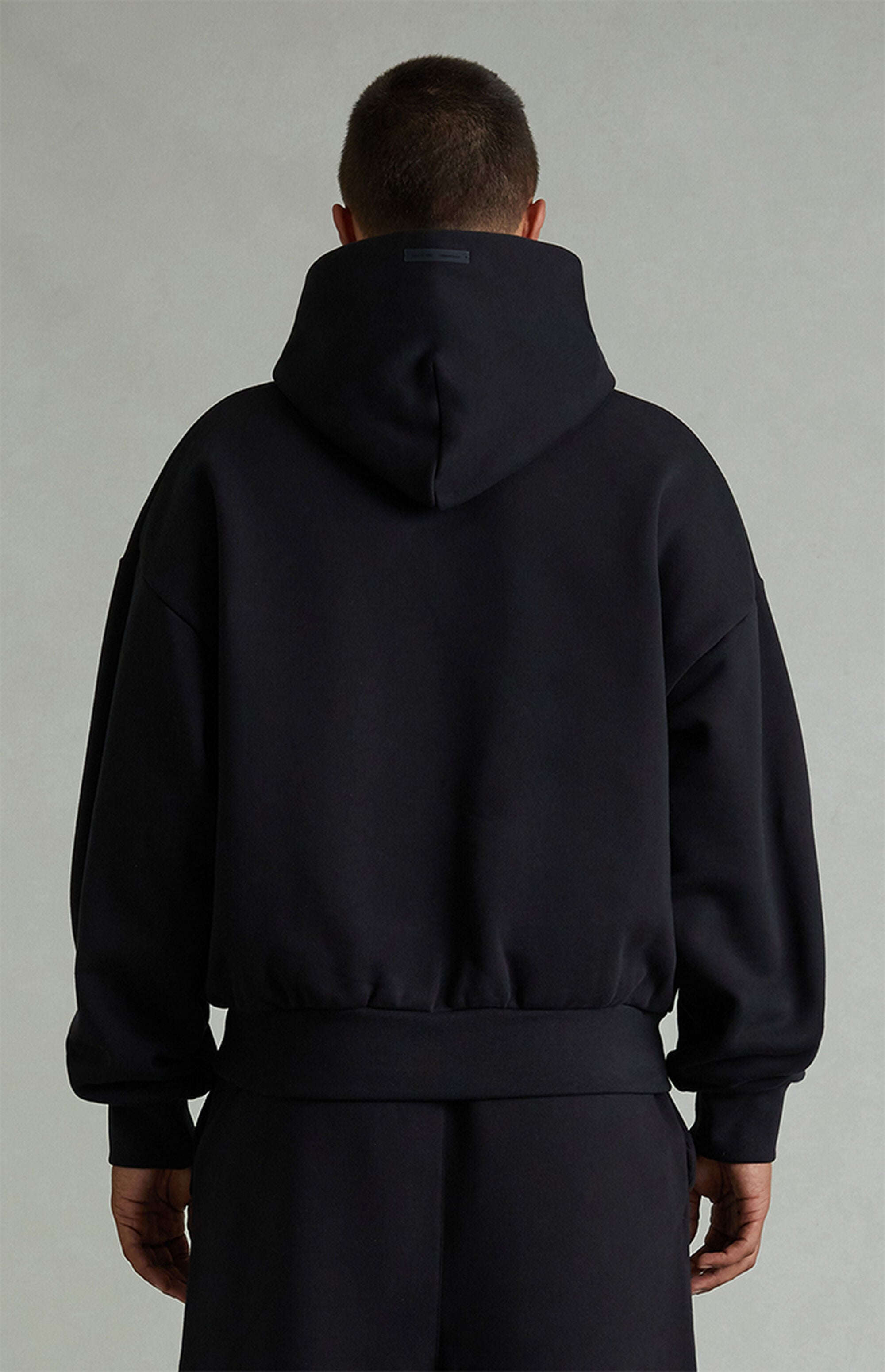 Fear of God ESSENTIALS Vintage Black Classic Fit Hoodie | Pacsun