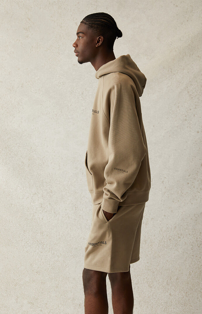 Fear of god essentials hoodie tan sales