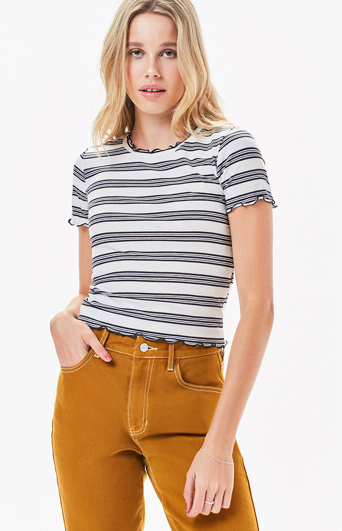 The Mock Neck Striped T-Shirt by LunaChix is the comfy piece missing from your wardrobe. Made from a ribbed fabric, this tee features a mock neckline, short sleeves, and lettuce edge trimming. Short sleeves Mock neckline Lettuce edge trimming Ribbed fabric Model is wearing a small 69% polyester, 27% rayon, 4% spandex Hand wash