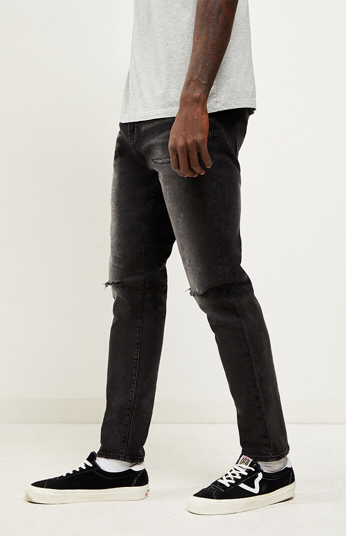 black ripped tapered jeans