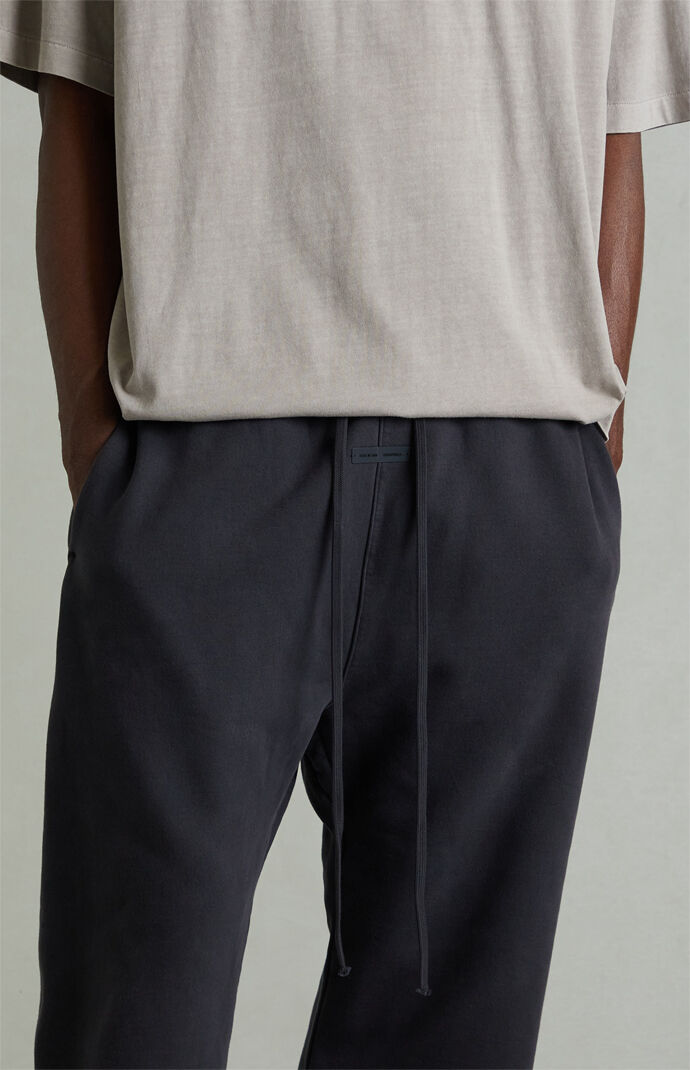 Fear of God ESSENTIALS Vintage Black Fleece Flare Sweatpants | Pacsun
