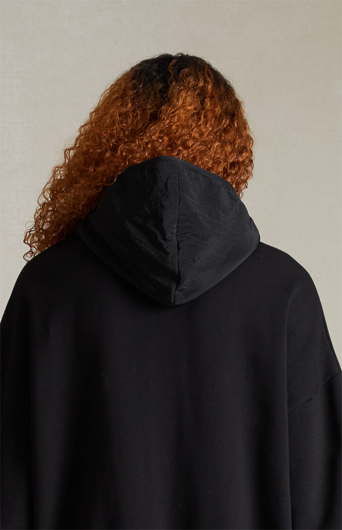 Fear of God Essentials Jet Black Nylon Fleece Hoodie | PacSun