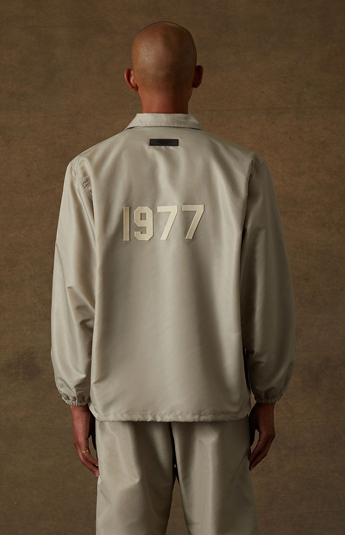 Fear of god essentials coach jacket online