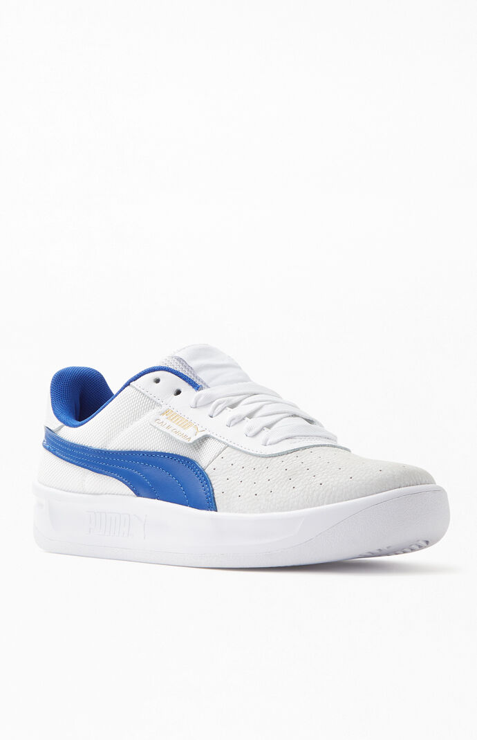 puma white and blue sneakers