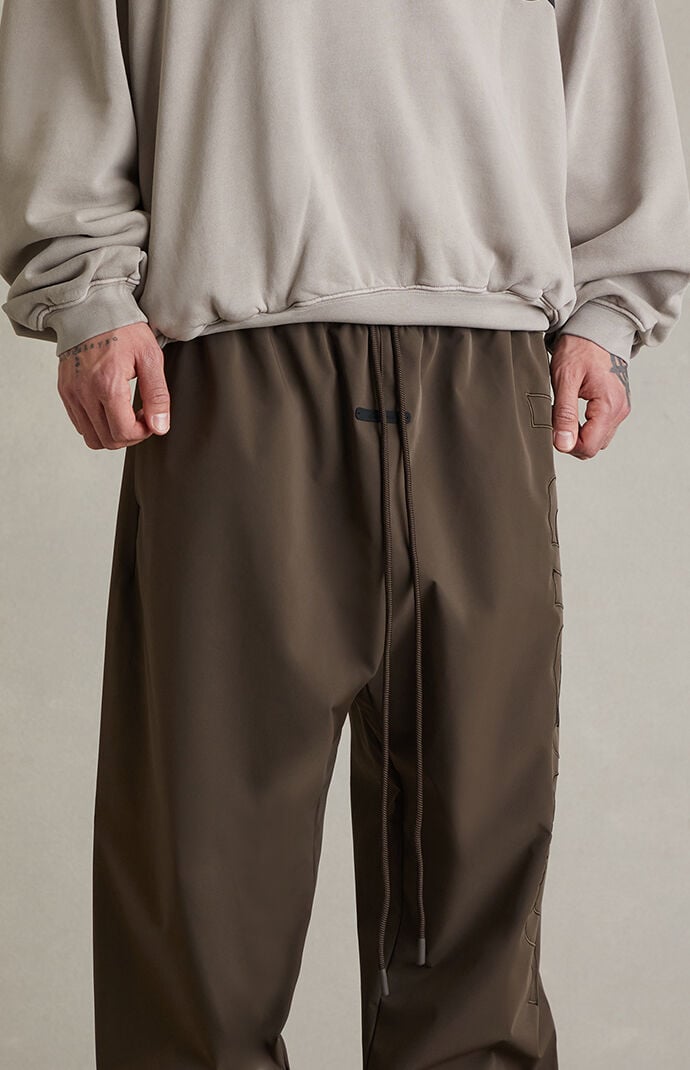 Fear of God ESSENTIALS Brown Active Trace Baggy Track Pants | Pacsun