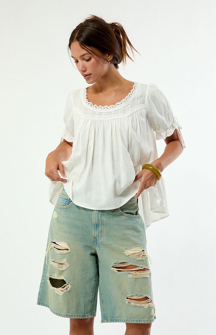 Levi's Light Blue Ripped Middy Jorts