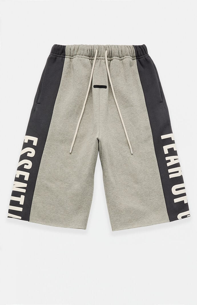 Fear of God ESSENTIALS Seal Paneled Raw Cutoff Sweat Shorts | Pacsun