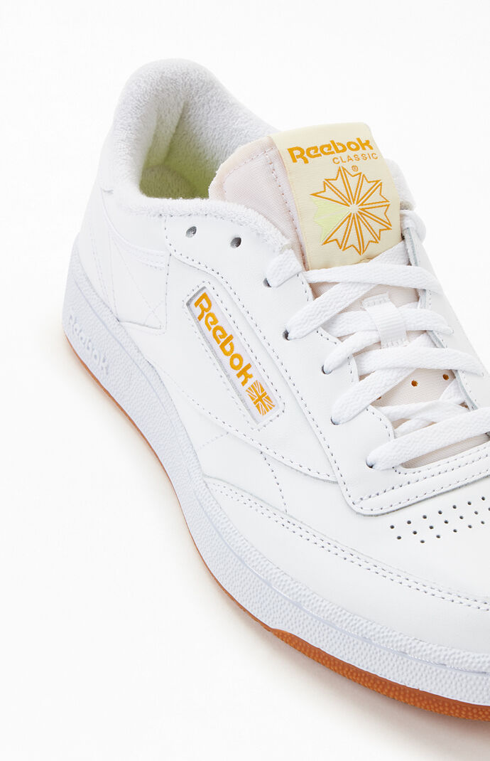 White and 2025 gold reebok