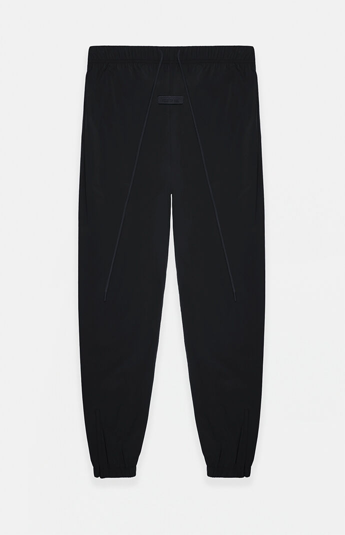 Fear of God Essentials Jet Black Nylon Track Pants PacSun