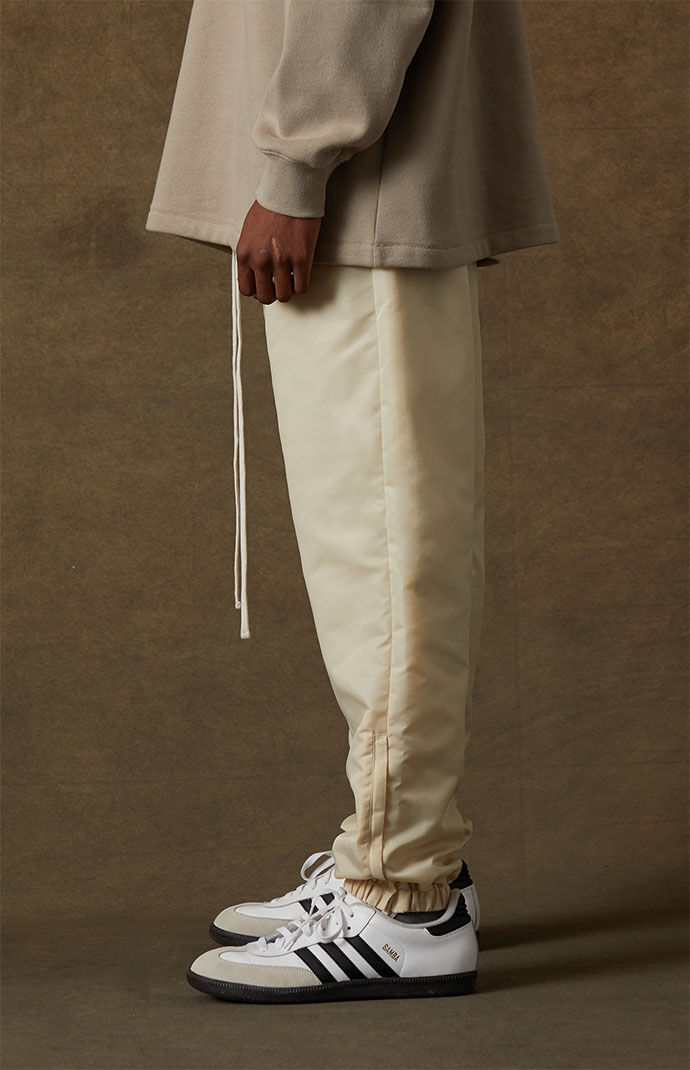 Fear of God Essentials Egg Shell Track Pants PacSun