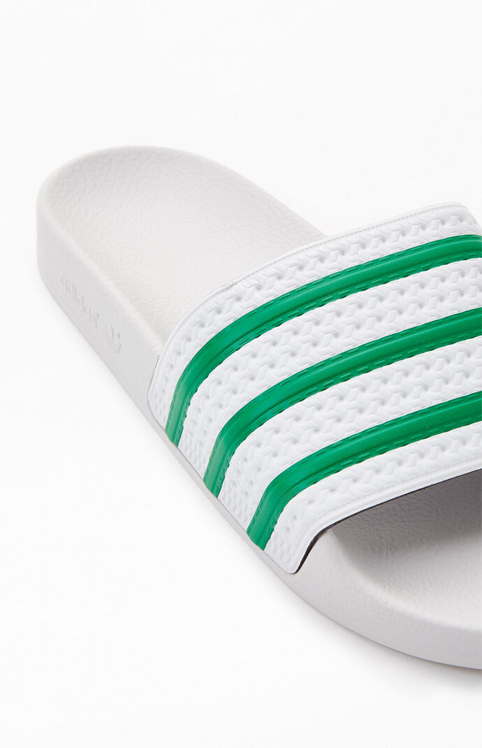 green and white adidas slides