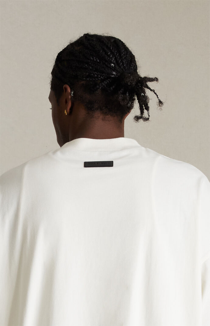 Fear of God Essentials Cloud Dancer T-Shirt | PacSun