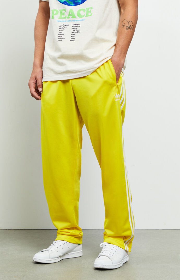 yellow and white adidas pants