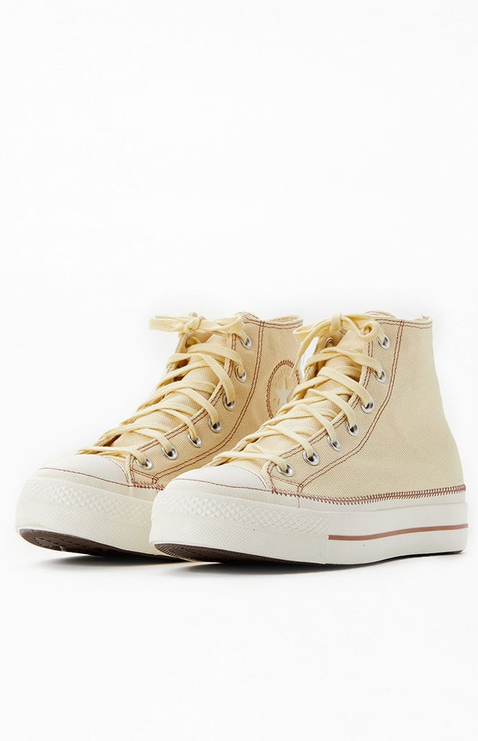 Cream high clearance top sneakers