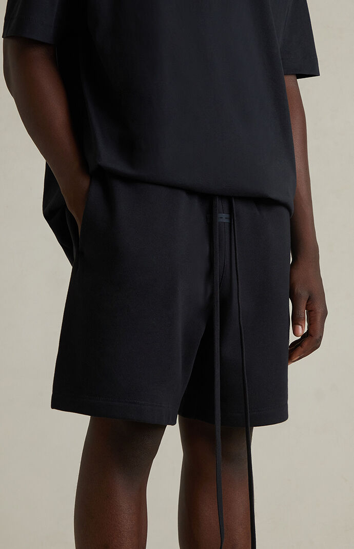 Fear of God ESSENTIALS Jet Black Soccer Fleece Sweat Shorts | Pacsun