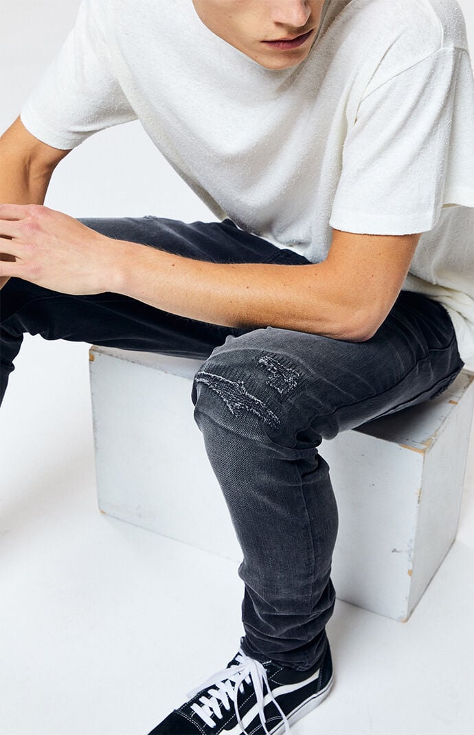 black ripped stacked skinny jeans