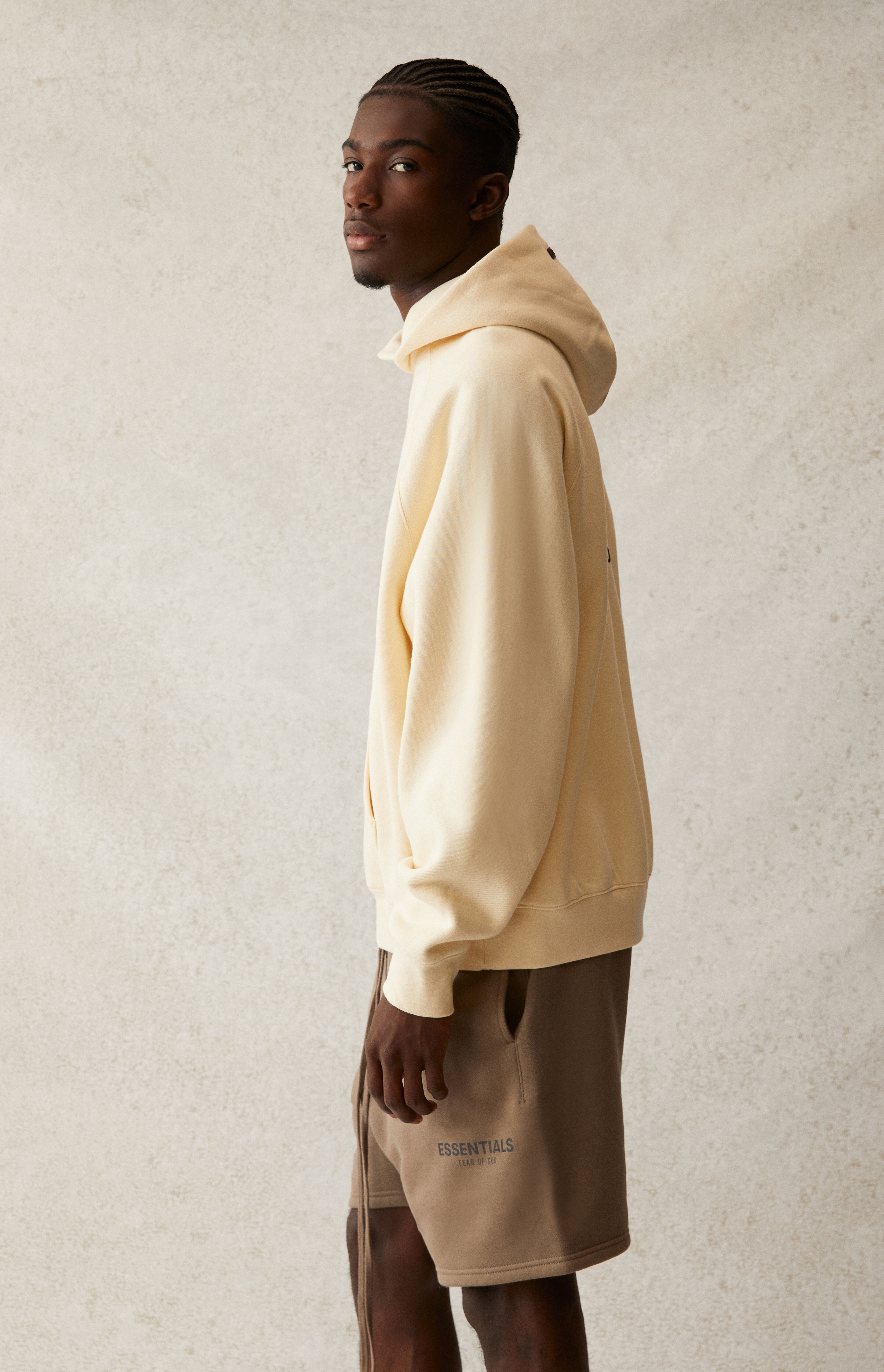 cream fear of god essentials hoodie