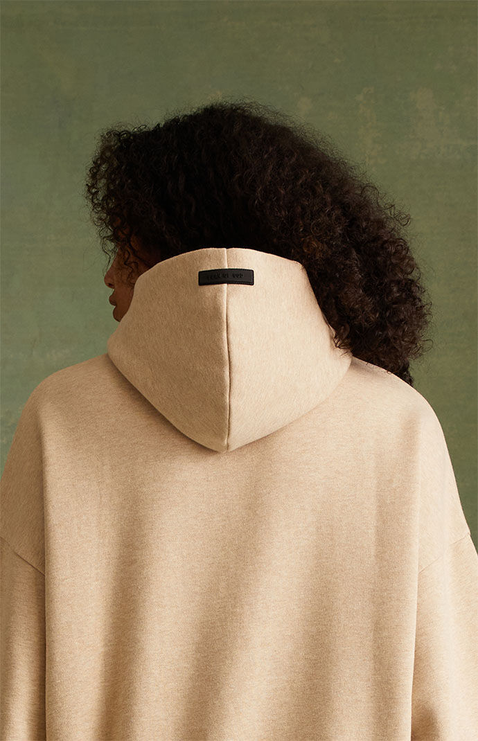Fear of God Essentials Gold Heather Hoodie | PacSun