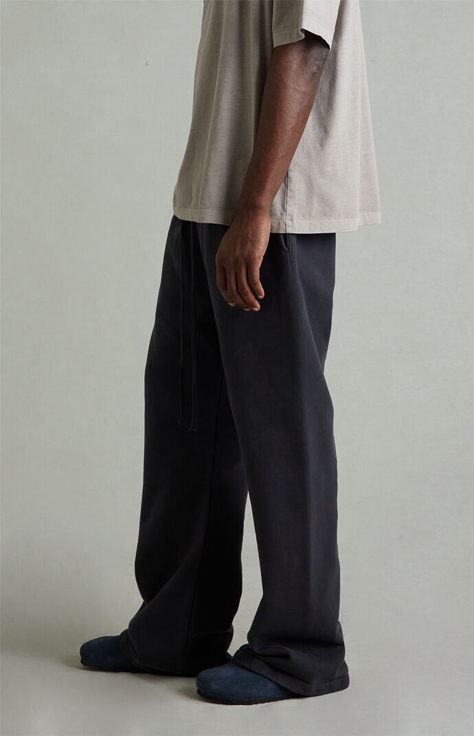 Fear of God ESSENTIALS Vintage Black Fleece Flare Sweatpants | Pacsun