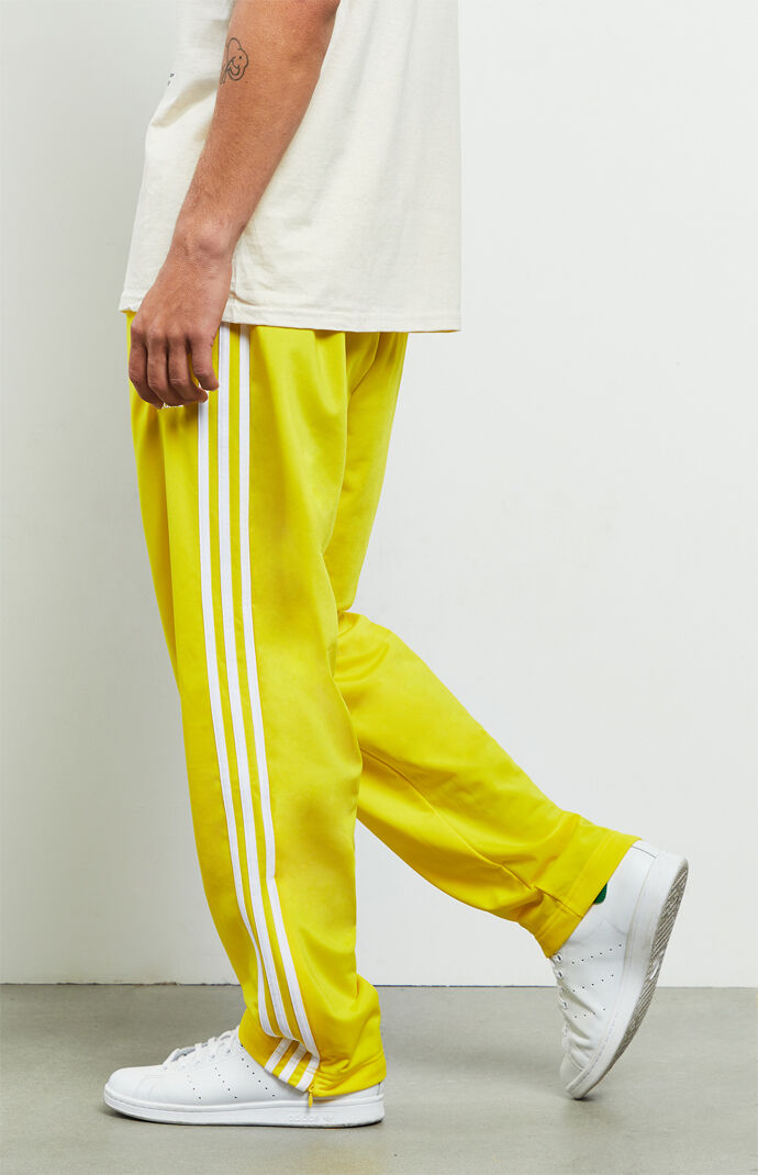 yellow adidas track pants