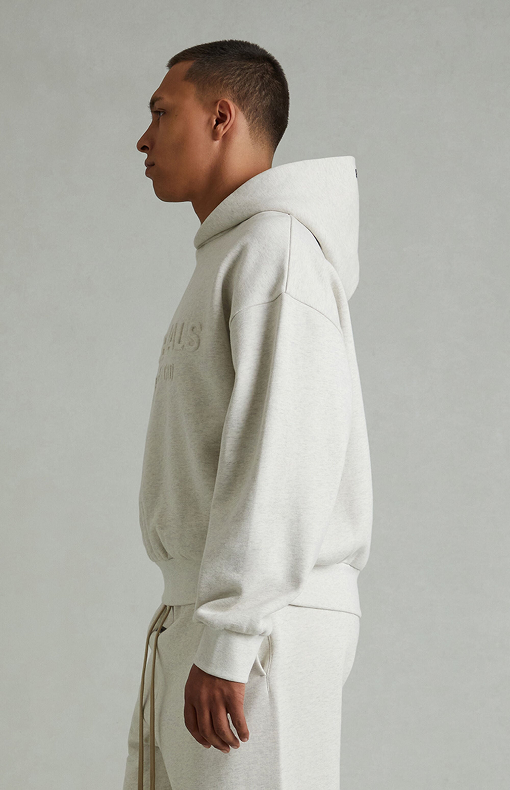 Fear of God ESSENTIALS Heather Oatmeal Embossed Classic Hoodie | Pacsun