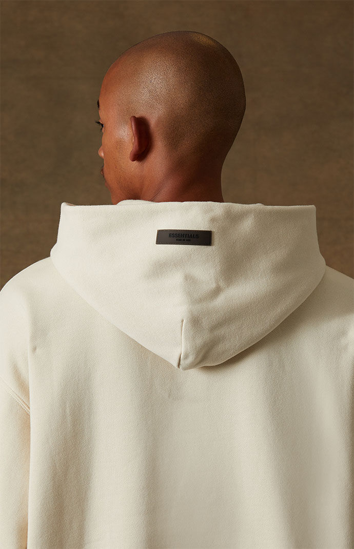 Fear of God Essentials Egg Shell Relaxed Hoodie | PacSun Fear of God Essentials Egg Shell Relaxed Hoodie | PacSun