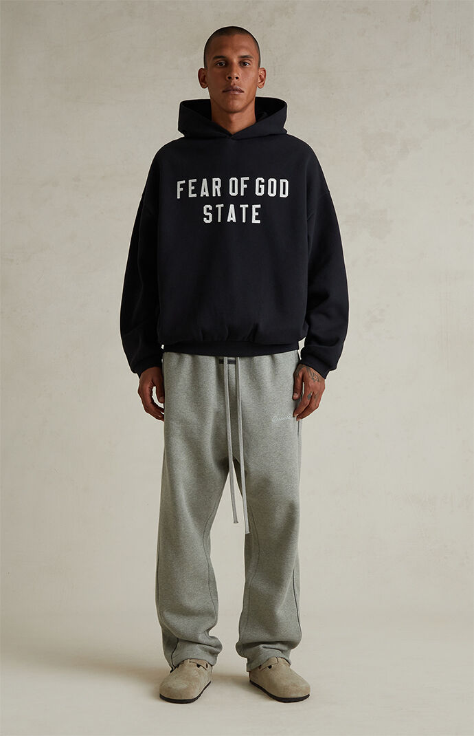 Fear of God ESSENTIALS Jet Black '90s Fit Fleece Hoodie | PacSun