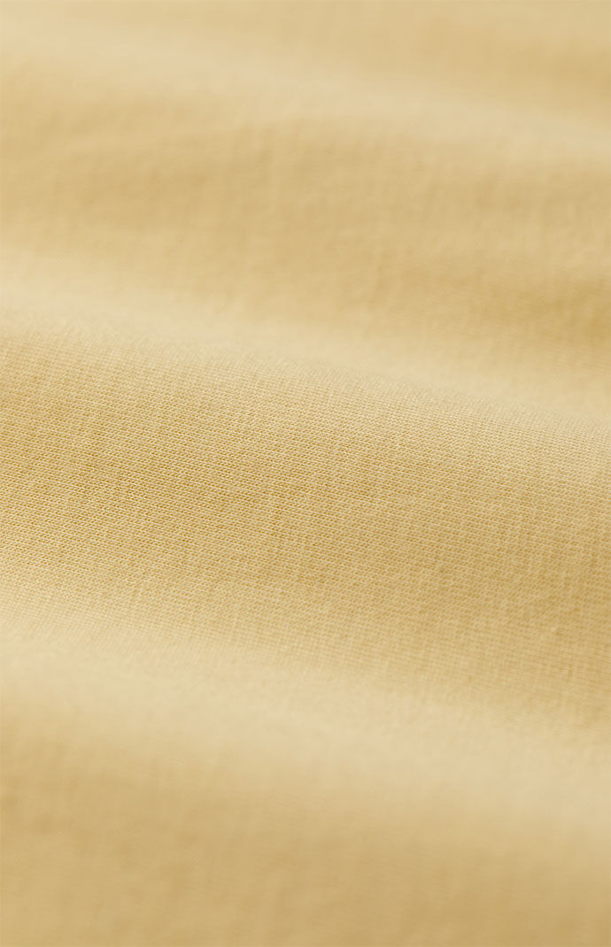 Fear of God Essentials Garden Yellow Heavy Football T-Shirt | PacSun
