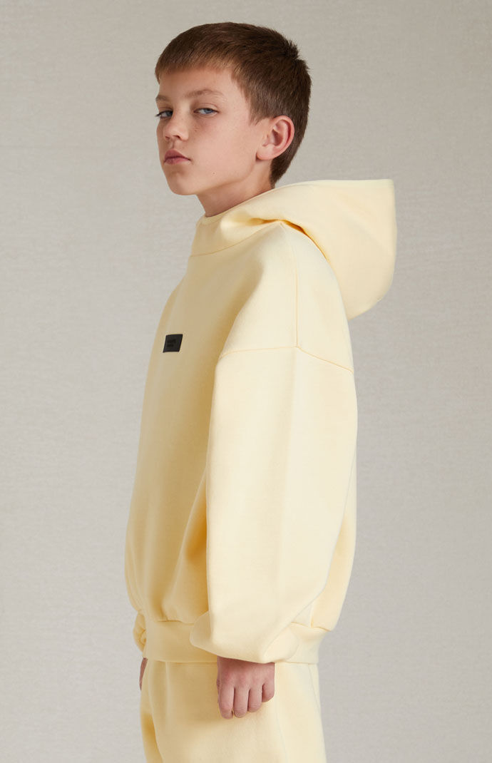 Kids Fear of God Essentials Garden Yellow Hoodie PacSun