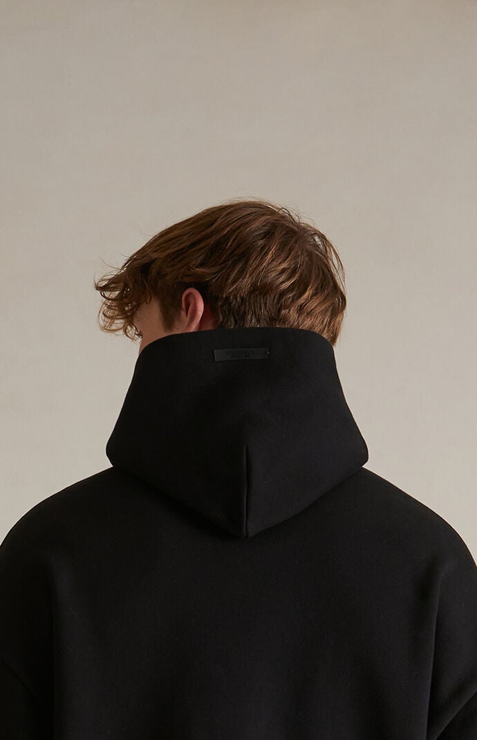 Fear of God Essentials Black Fleece Hoodie | PacSun