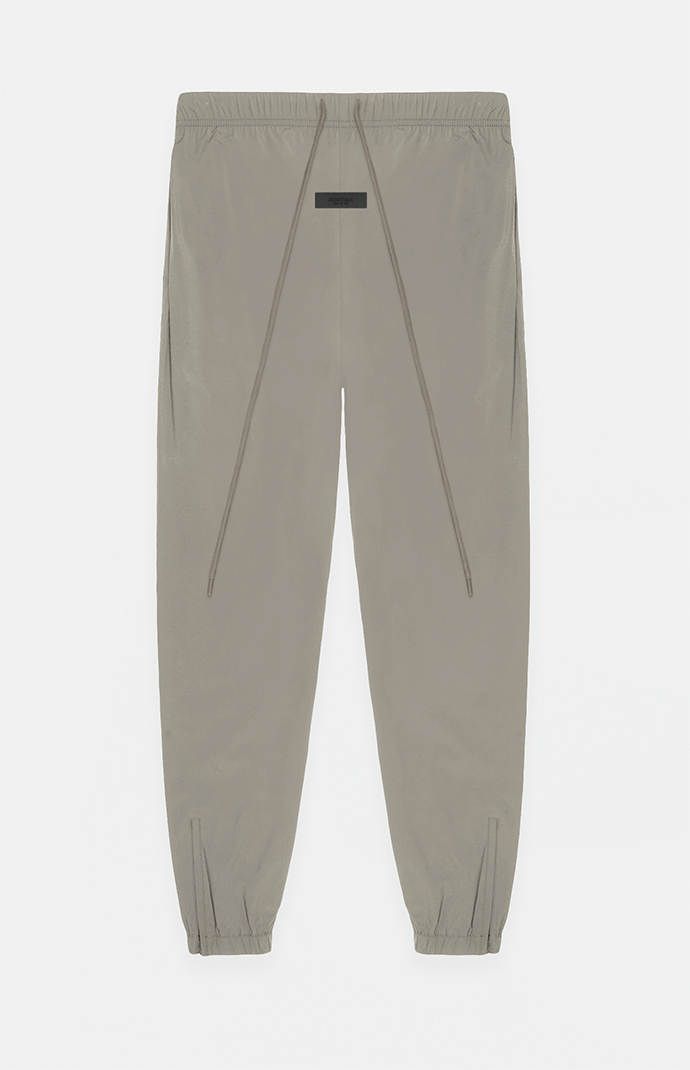 Fear of God Essentials Dust Nylon Track Pants | PacSun