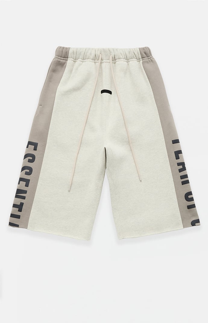 Fear of God ESSENTIALS Vanilla Paneled Raw Cutoff Sweat Shorts