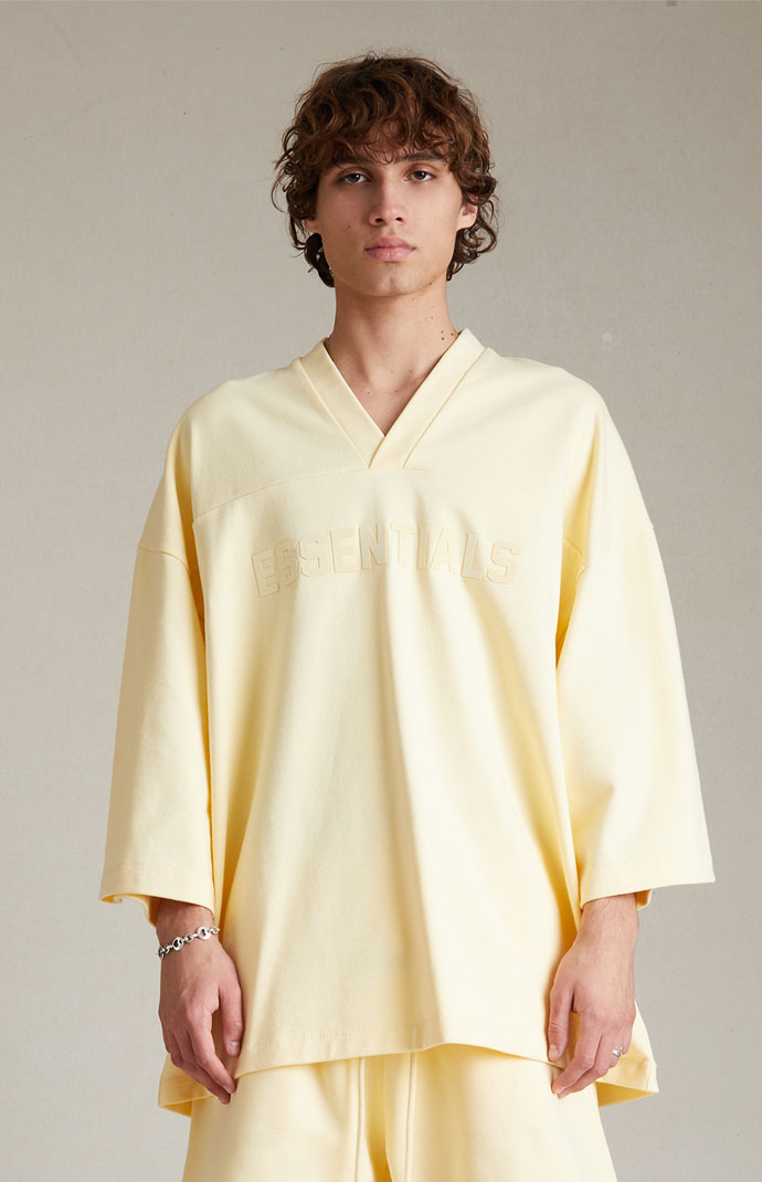 Fear of God Essentials Garden Yellow Heavy Football T-Shirt | PacSun
